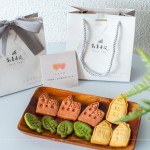 伴手禮贈(zèng)送『迦南園烘焙庇護(hù)工場』的公益餅乾，可愛、溫馨兼顧著美味，為這場活動(dòng)增添一份愛的溫度。
